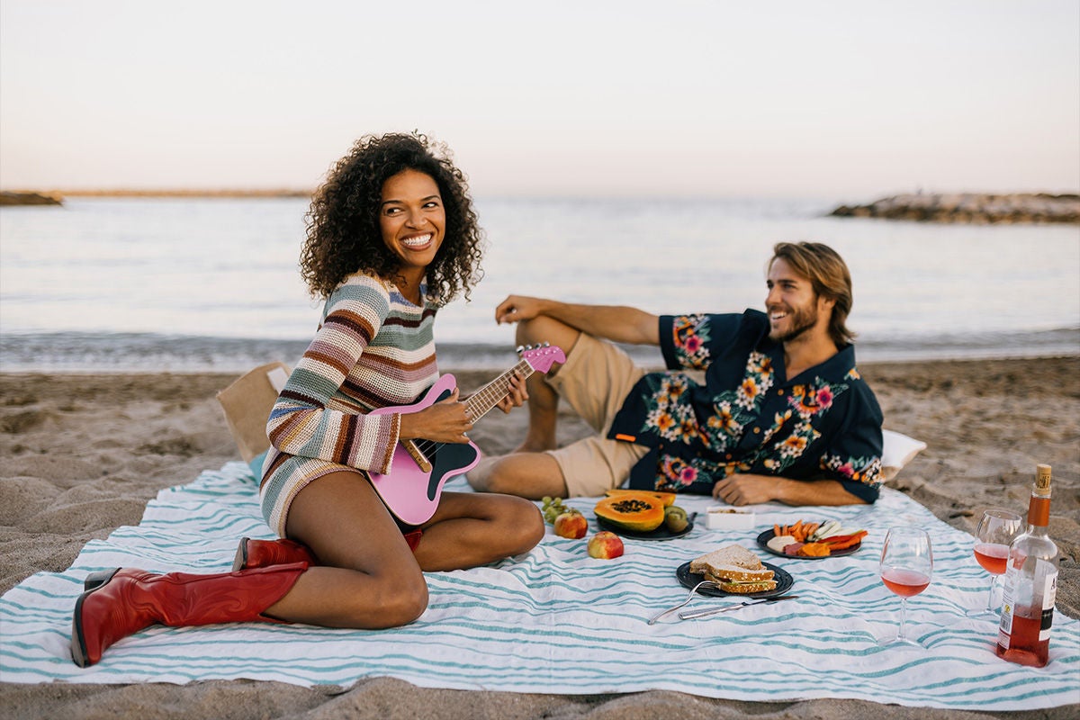 Couple on the beach celebrating Pinktober 